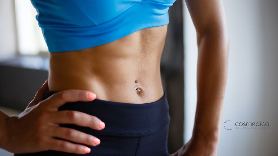 woman's flat stomach and six pack