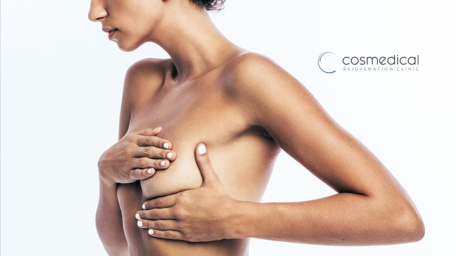 woman covering breasts