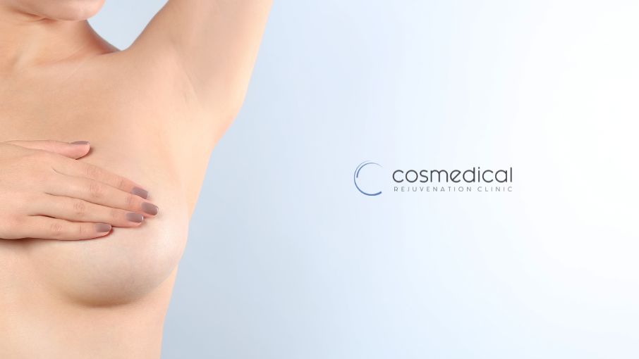woman holding breast