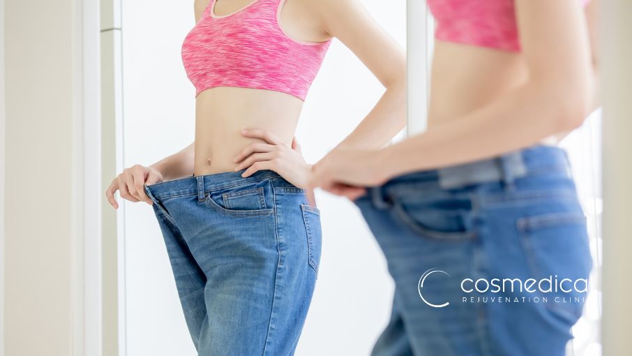 woman looking at stomach