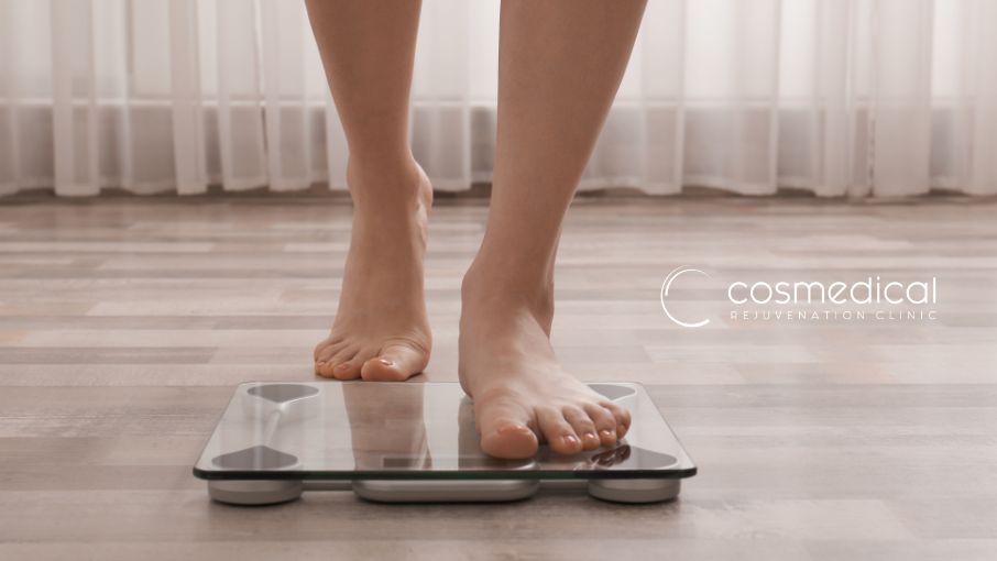 woman stepping on scale